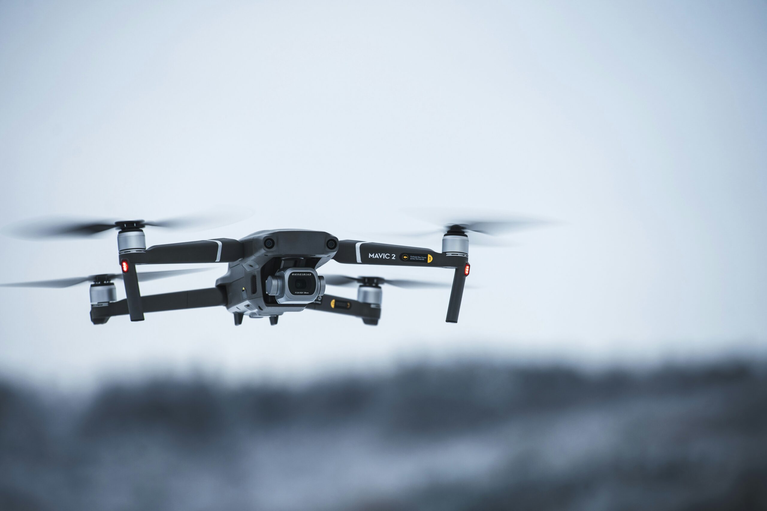 A high-tech drone with a camera flies through the air, demonstrating its ability to verify local businesses through aerial imagery for SEO purposes.